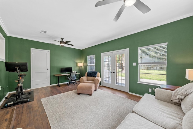 211 N 40th St, Waco, TX 76710 - living room featuring ceiling fan, an office area, french doors, ornamental molding, and dark wood-style flooring