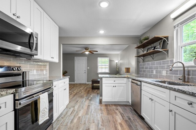 406 N Ruddell St, Denton, TX 76209 - kitchen featuring appliances with stainless steel finishes, a sink, ceiling fan, white cabinets, and recessed lighting