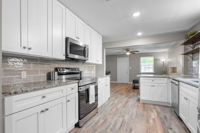 406 N Ruddell St, Denton, TX 76209 - kitchen with appliances with stainless steel finishes, open shelves, ceiling fan, white cabinets, and recessed lighting