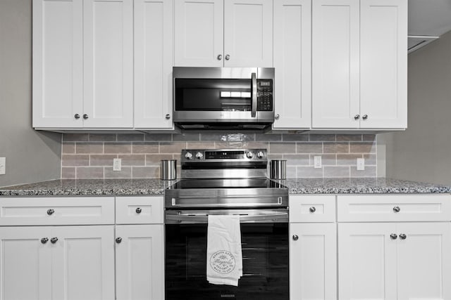 406 N Ruddell St, Denton, TX 76209 - kitchen featuring appliances with stainless steel finishes, backsplash, and light stone counters