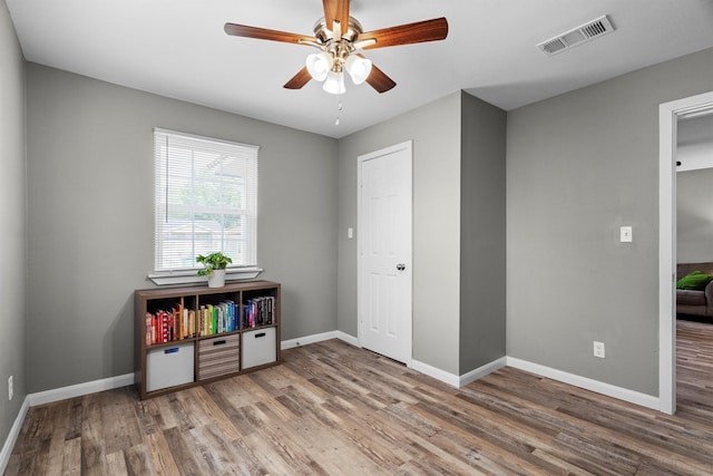 406 N Ruddell St, Denton, TX 76209 - rec room featuring wood finished floors, ceiling fan, and baseboards
