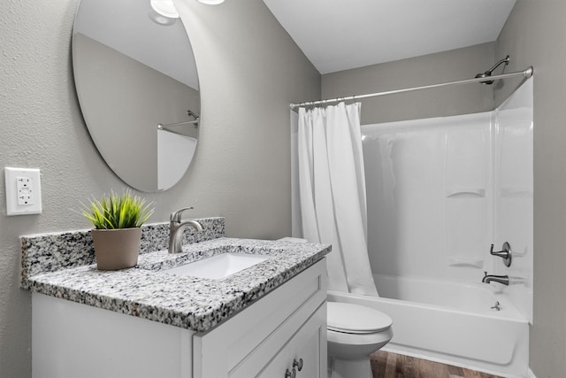 406 N Ruddell St, Denton, TX 76209 - full bath featuring wood finished floors, vanity, shower / tub combo with curtain, and toilet