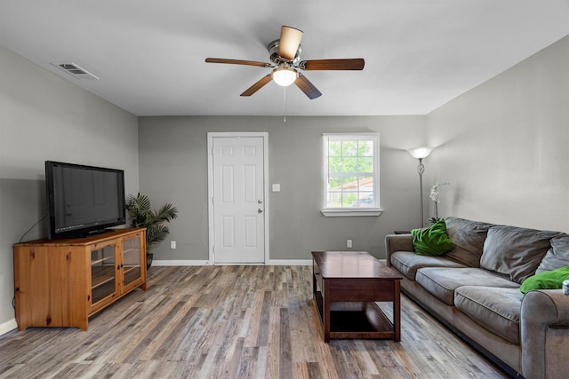406 N Ruddell St, Denton, TX 76209 - living room with light wood finished floors, ceiling fan, and baseboards