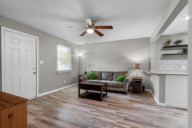 406 N Ruddell St, Denton, TX 76209 - living area featuring a ceiling fan, light wood-style flooring, and baseboards