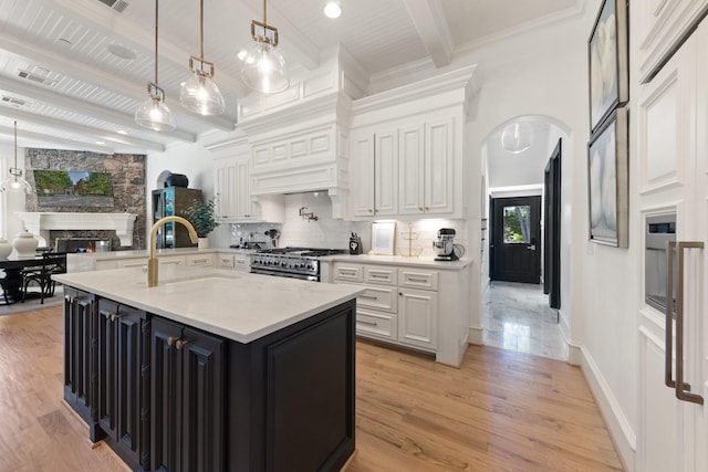 2 Terrabella Ln, Heath, TX 75032 - kitchen featuring stainless steel range, white cabinetry, dark cabinetry, and wood ceiling with exposed beams