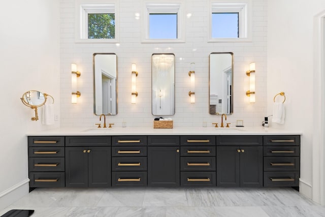 2 Terrabella Ln, Heath, TX 75032 - bathroom with double vanity, baseboards, marble look tiles, and backsplash