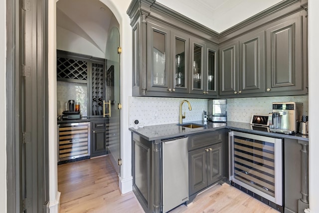 2 Terrabella Ln, Heath, TX 75032 - indoor bar featuring wine cooler, decorative backsplash, light wood-style flooring, and crown molding