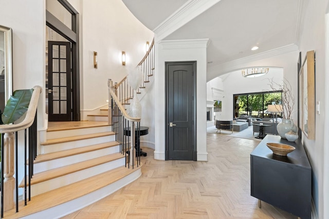 2 Terrabella Ln, Heath, TX 75032 - entryway featuring ornamental molding, arched walkways, stairs, baseboards, and recessed lighting
