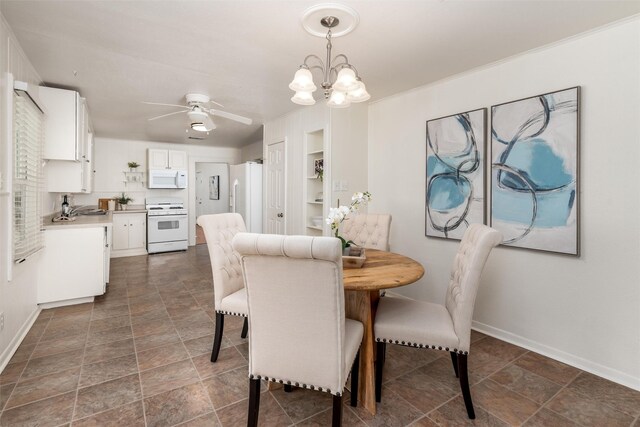 1311 Oak St, Mckinney, TX 75069 - dining space featuring baseboards, a chandelier, a ceiling fan, built in shelves, and stone finish floors