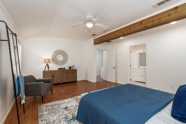 1311 Oak St, Mckinney, TX 75069 - bedroom with wood finished floors, crown molding, baseboards, vaulted ceiling, and ensuite bathroom