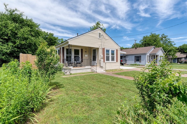 1311 Oak St, Mckinney, TX 75069 - bungalow-style house with covered porch and a front yard