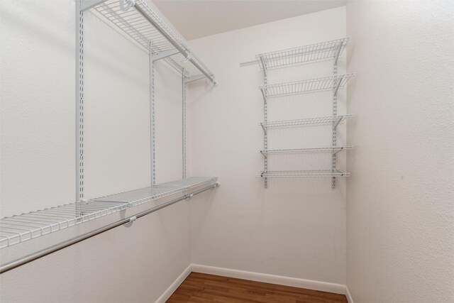 1311 Oak St, Mckinney, TX 75069 - spacious closet with wood finished floors