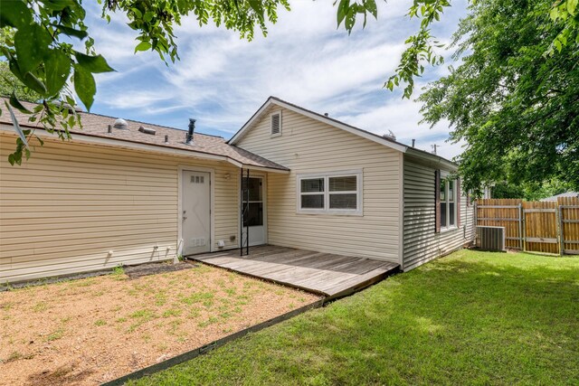 1311 Oak St, Mckinney, TX 75069 - back of property with a deck and central AC