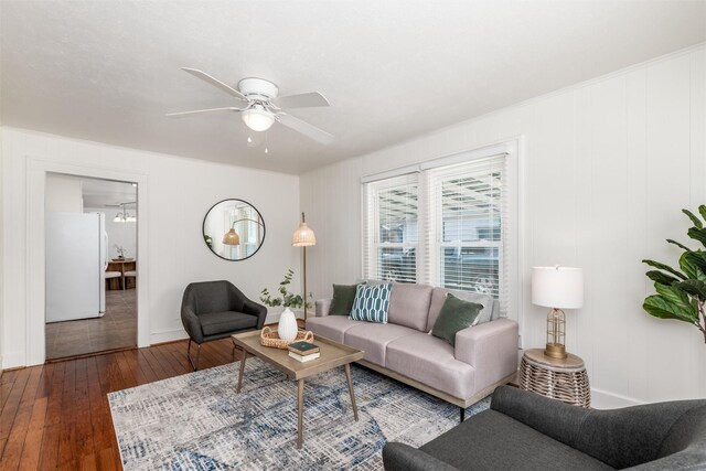 1311 Oak St, Mckinney, TX 75069 - living area featuring hardwood / wood-style flooring, a ceiling fan, and baseboards