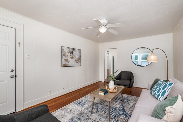 1311 Oak St, Mckinney, TX 75069 - living room featuring wood finished floors, a ceiling fan, and baseboards