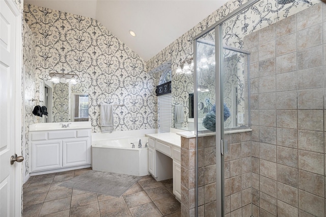 437 Fox Trl, Allen, TX 75002 - bathroom featuring vaulted ceiling, a bath, vanity, a shower stall, and wallpapered walls