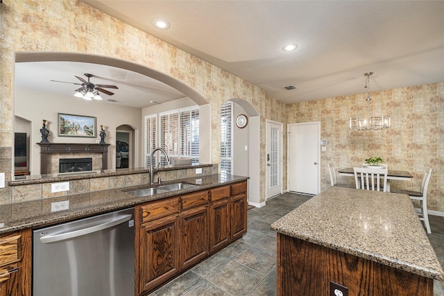 437 Fox Trl, Allen, TX 75002 - kitchen featuring dishwasher, a sink, ceiling fan, dark stone countertops, and recessed lighting