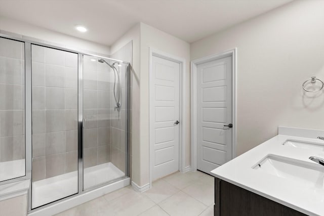 719 Dove Haven Way, Lavon, TX 75166 - full bathroom featuring a shower stall, tile patterned flooring, double vanity, and baseboards