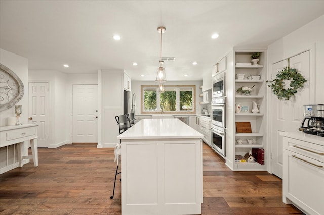 145 Vista Dr, Eustace, TX 75124 - kitchen with open shelves, a kitchen breakfast bar, stainless steel appliances, a center island, and recessed lighting