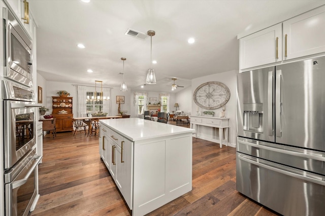 145 Vista Dr, Eustace, TX 75124 - kitchen with stainless steel appliances, recessed lighting, a center island, light countertops, and a ceiling fan