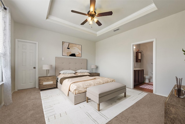 1816 Gayla Creek Dr, Little Elm, TX 75068 - bedroom with a raised ceiling, light colored carpet, ornamental molding, connected bathroom, and ceiling fan