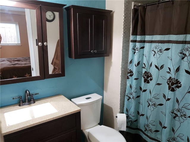3102 Chestnut Rd, Carrollton, TX 75007 - bathroom featuring vanity, toilet, and a shower with curtain