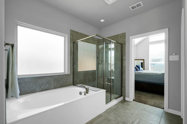 2806 Palmerston Dr, Midlothian, TX 76065 - ensuite bathroom featuring a bath, a stall shower, tile patterned floors, and baseboards
