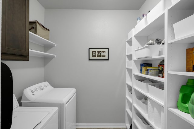 2806 Palmerston Dr, Midlothian, TX 76065 - washroom with washer and clothes dryer, cabinet space, and baseboards