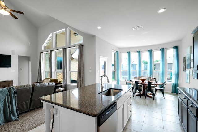 2806 Palmerston Dr, Midlothian, TX 76065 - kitchen featuring a sink, dishwasher, dark stone counters, open floor plan, and recessed lighting