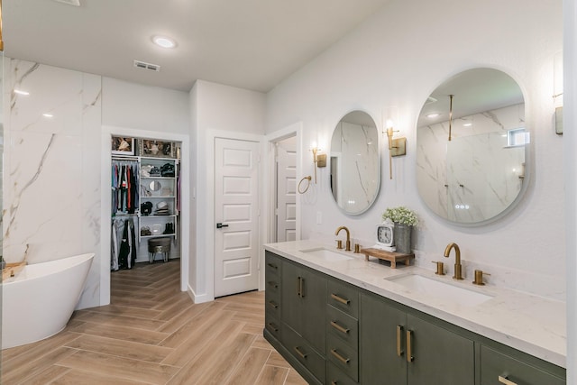 14709 Storyteller Ln, Fort Worth, TX 76052 - full bath featuring double vanity, a soaking tub, a walk in closet, and a marble finish shower