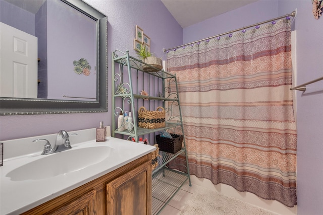 1053 Pullman Dr, Saginaw, TX 76131 - full bathroom featuring tile patterned flooring, vanity, and a shower with curtain