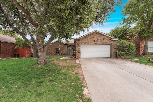 1053 Pullman Dr, Saginaw, TX 76131 - ranch-style home featuring an attached garage, brick siding, concrete driveway, and a front lawn