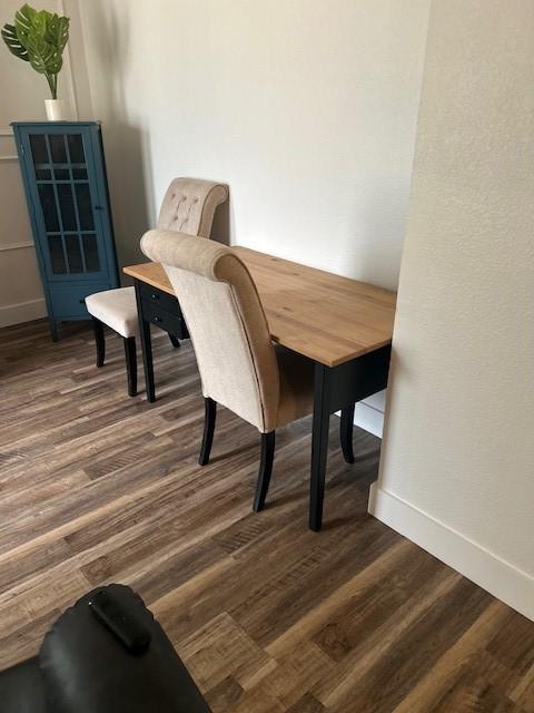 3624 Aurora St, Haltom City, TX 76117 - dining area with dark wood-style floors and baseboards