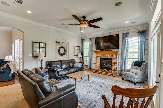 336 Maggie St, Canton, TX 75103 - living area featuring arched walkways, a ceiling fan, crown molding, a fireplace, and recessed lighting