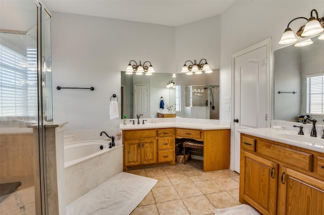 336 Maggie St, Canton, TX 75103 - bathroom with a stall shower, a bath, two vanities, and tile patterned floors