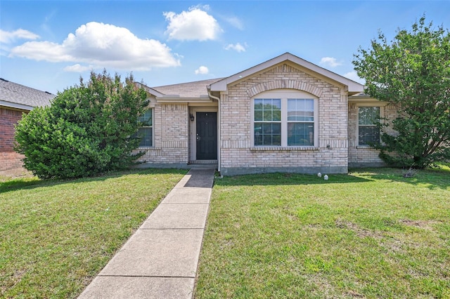 2712 Murphy Dr, Lancaster, TX 75134 - view of front facade with a front yard and brick siding