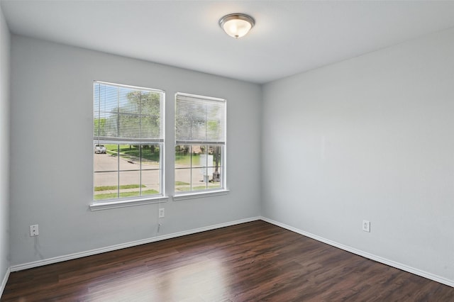 2712 Murphy Dr, Lancaster, TX 75134 - unfurnished room with healthy amount of natural light, dark wood finished floors, and baseboards
