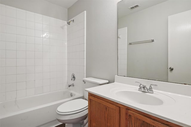 2712 Murphy Dr, Lancaster, TX 75134 - bathroom featuring vanity, toilet, and washtub / shower combination
