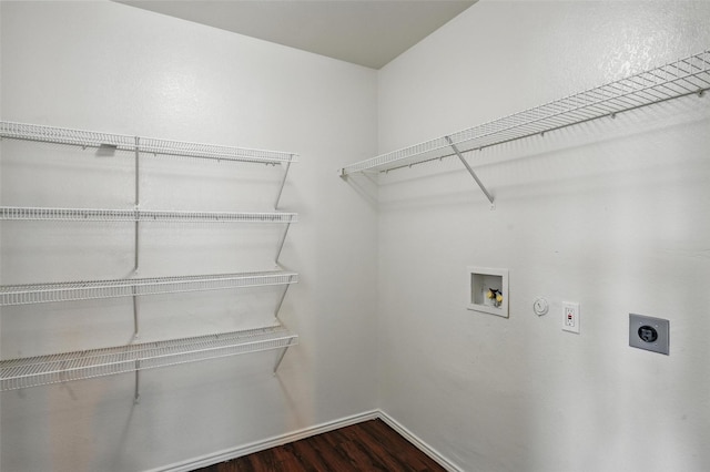2712 Murphy Dr, Lancaster, TX 75134 - laundry room with electric dryer hookup, dark wood-style flooring, washer hookup, and baseboards