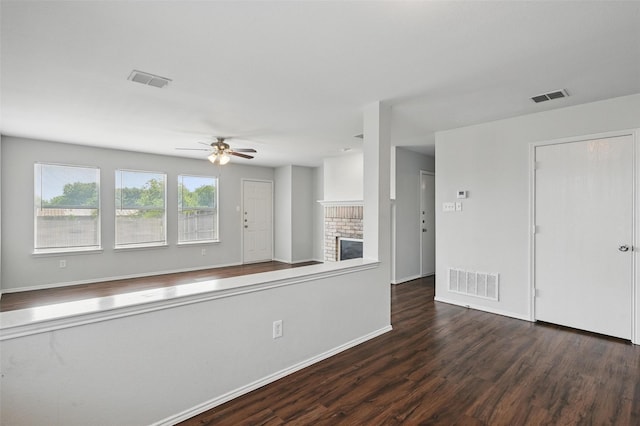 2712 Murphy Dr, Lancaster, TX 75134 - kitchen featuring ceiling fan, wood finished floors, a brick fireplace, and baseboards