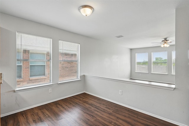 2712 Murphy Dr, Lancaster, TX 75134 - unfurnished room with wood finished floors, baseboards, and a ceiling fan