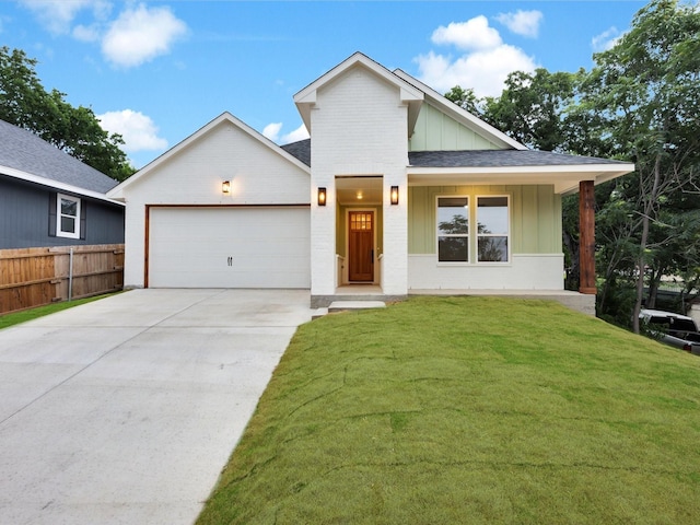 2207 Irion Ave, Fort Worth, TX 76106 - view of front facade featuring board and batten siding, an attached garage, concrete driveway, and a shingled roof
