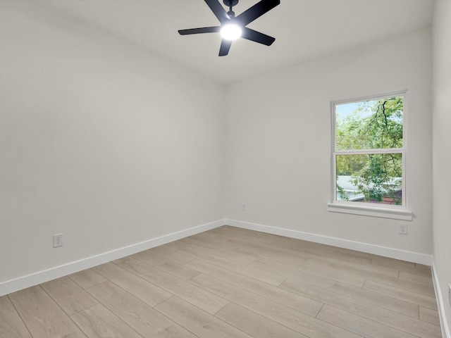 2207 Irion Ave, Fort Worth, TX 76106 - empty room with light wood finished floors, baseboards, and a ceiling fan