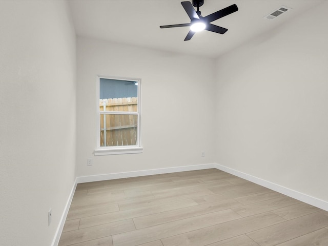 2207 Irion Ave, Fort Worth, TX 76106 - empty room with light wood finished floors, baseboards, and ceiling fan