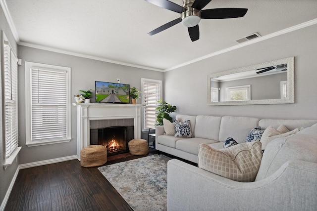 2617 Benbrook Blvd, Fort Worth, TX 76109 - living room featuring dark wood-style flooring, crown molding, baseboards, a fireplace with flush hearth, and a ceiling fan