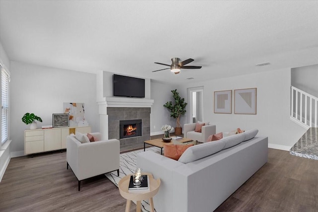 4204 Birch Creek Rd, Fort Worth, TX 76244 - living room with wood finished floors, a ceiling fan, a fireplace, and baseboards