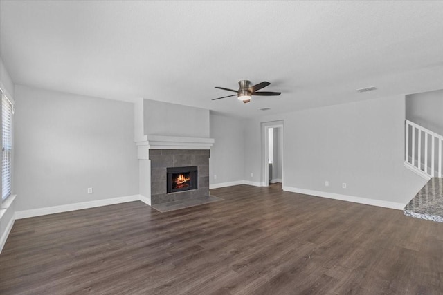 4204 Birch Creek Rd, Fort Worth, TX 76244 - unfurnished living room featuring a ceiling fan, dark wood-type flooring, a fireplace, and baseboards