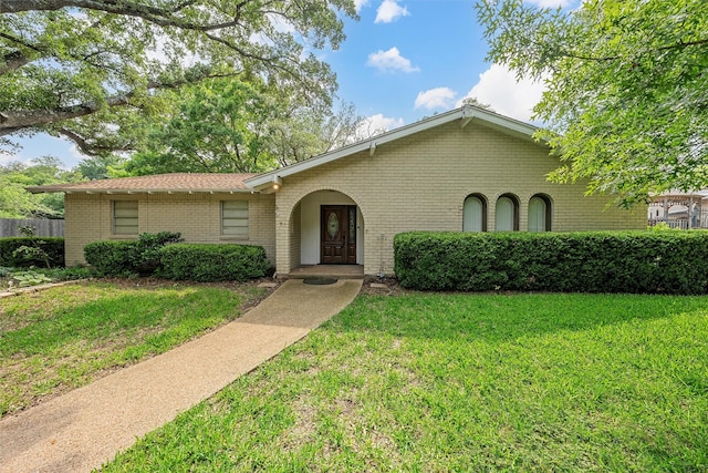 120 Wooded Crest Dr, Woodway, TX 76712 - view of front of house featuring brick siding and a front lawn