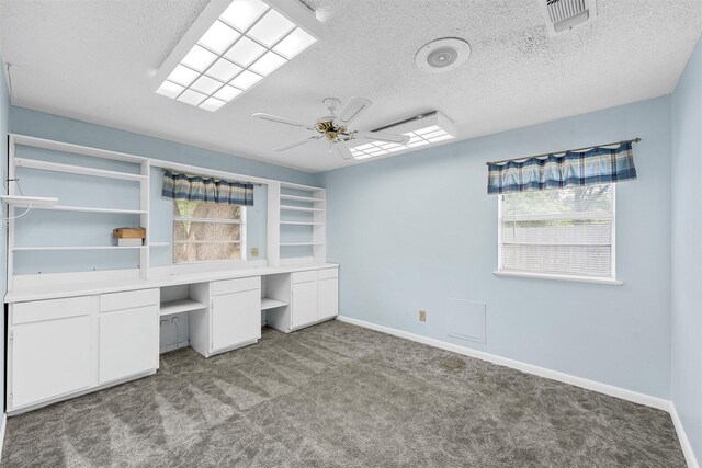 120 Wooded Crest Dr, Woodway, TX 76712 - unfurnished office featuring plenty of natural light, ceiling fan, carpet flooring, a textured ceiling, and baseboards