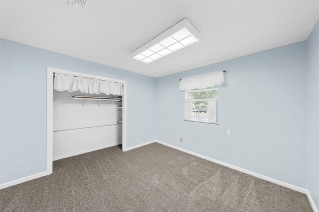 120 Wooded Crest Dr, Woodway, TX 76712 - unfurnished bedroom with carpet flooring, baseboards, a closet, and a textured ceiling